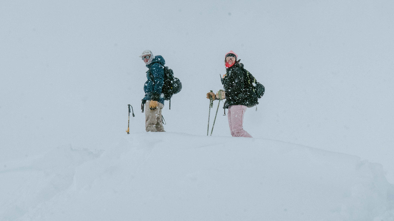 skiers in snowstorm