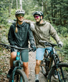 ws scout jacket in black lifestyle image couple sitting posing on mountain bikes