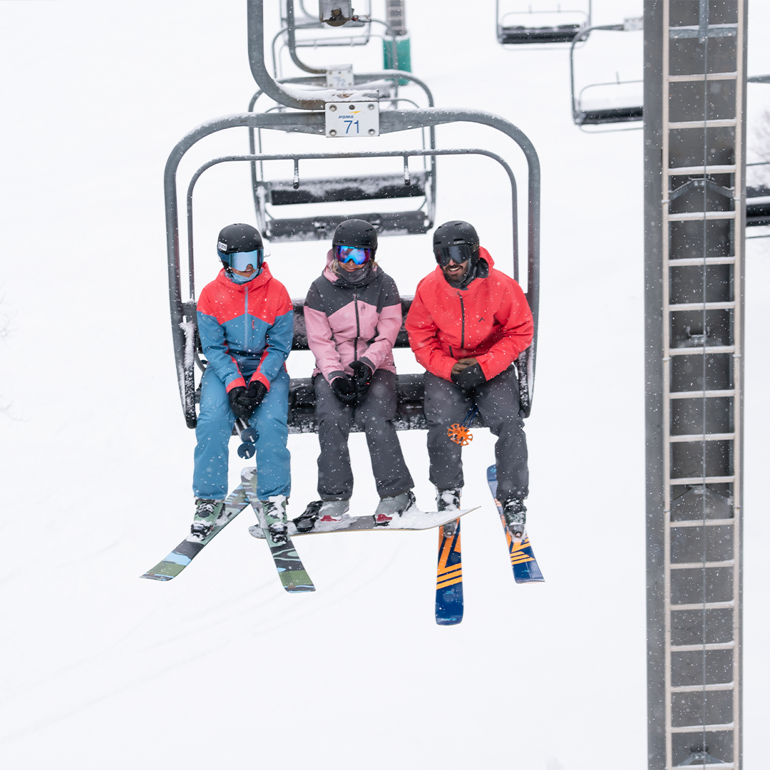 warm skiers on lift