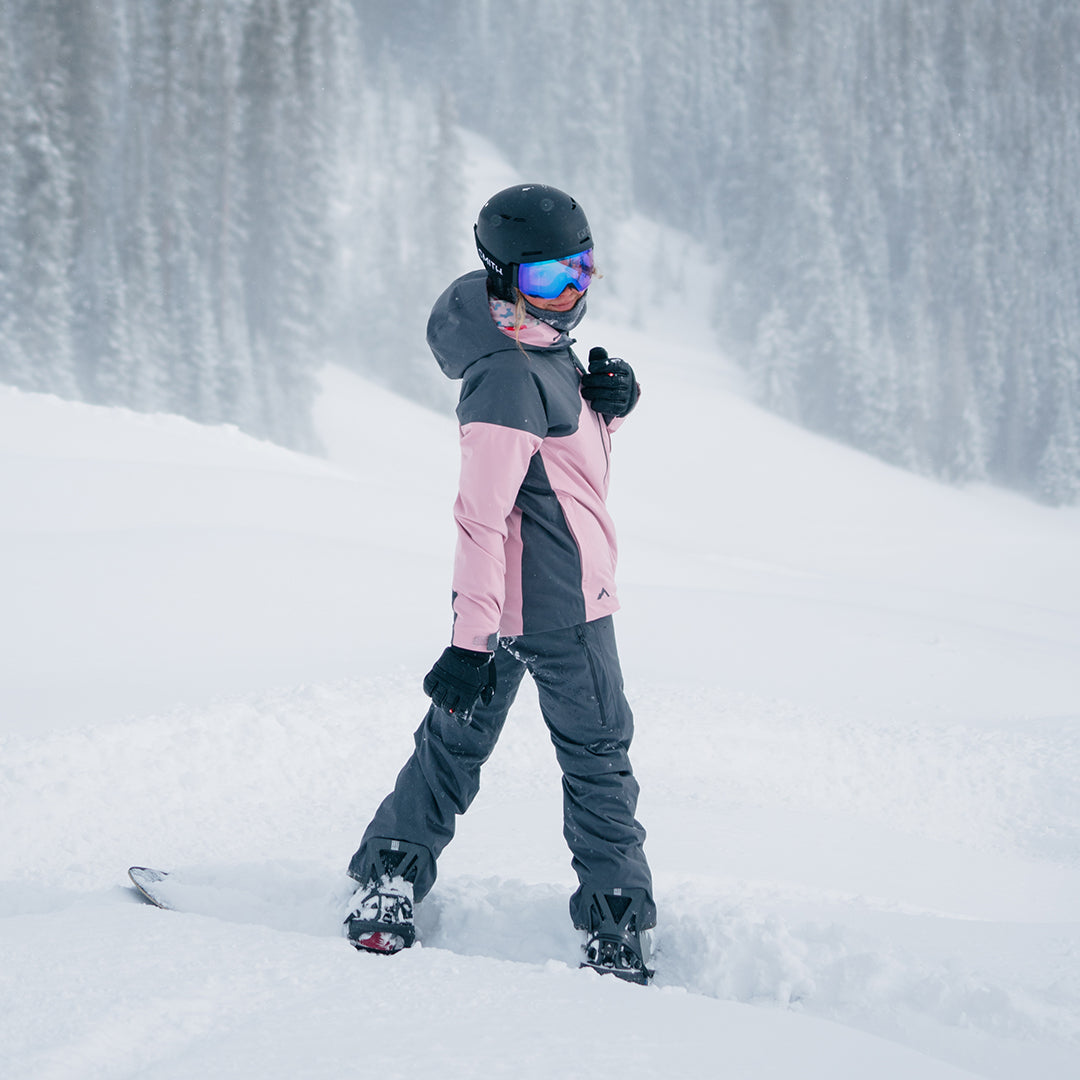 ws snowboarder looking back over shoulder