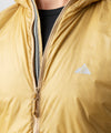 studio on-model image of strafe outerwear 2023 ms ultralight aero insulator in dune color